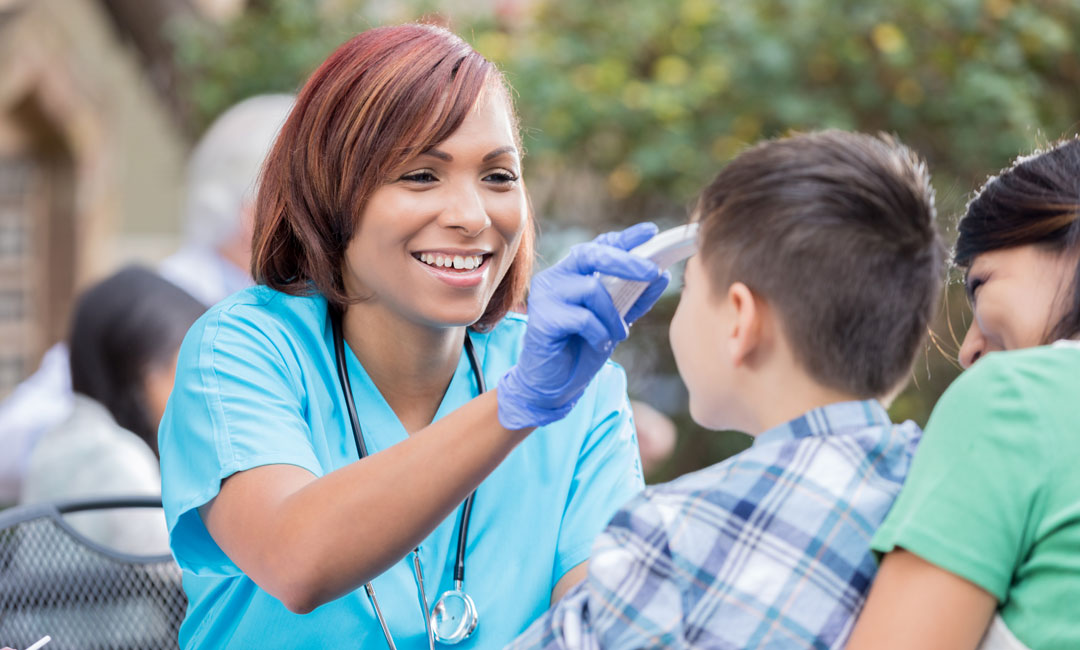 Nurse helping a young patient